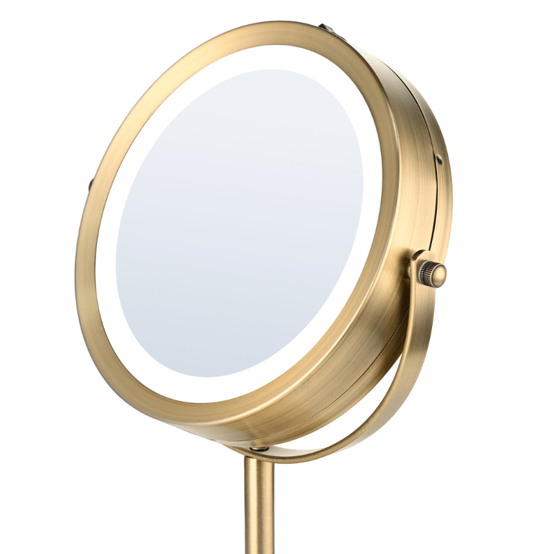 Primer plano del cabezal ajustable del espejo de maquillaje dorado con función de inclinación