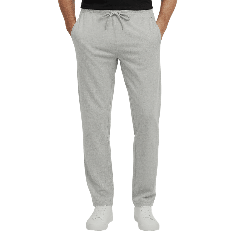 Pantalones de chándal grises con cordón en la cintura y bolsillos con cremallera, vistos de frente en una persona