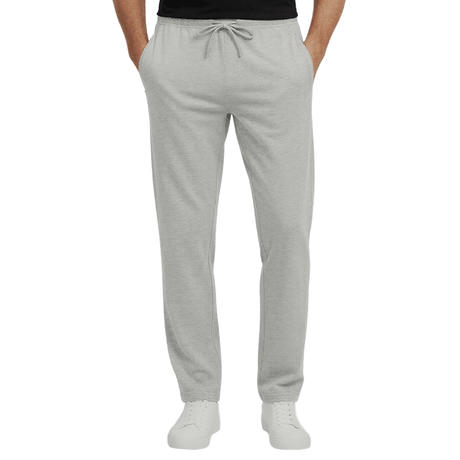 Pantalones de chándal grises con cordón en la cintura y bolsillos con cremallera, vistos de frente en una persona