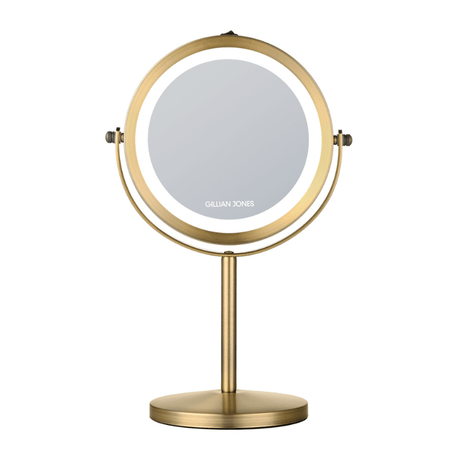 Espejo de maquillaje redondo dorado con luz LED, vista frontal con logo Gillian Jones