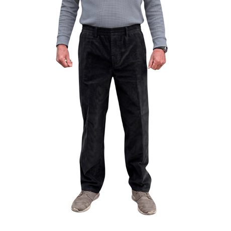 Pantalones de pana negros con cintura elástica y costuras clásicas vistos de frente en una persona