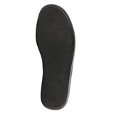 Suela exterior antideslizante negra de una zapatilla de casa para hombre, vista desde abajo con textura