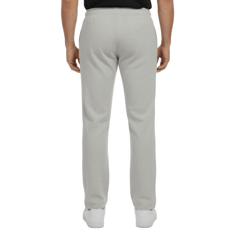 Pantalones de chándal grises con cintura elástica y costuras discretas, vistos de espalda en una persona