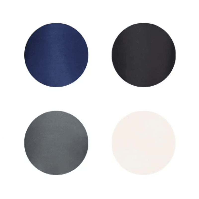 Cuatro muestras de color redondas que muestran los colores disponibles del cojín lumbar: azul, negro, gris y beige claro